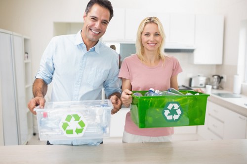 Risk assessment checklist and waste segregation bins at an office site